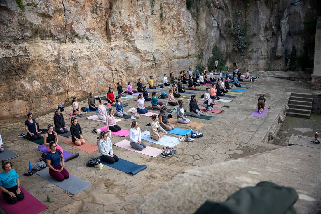 A meditation group in AURA headphones